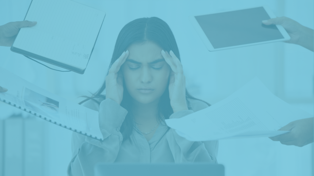 Lady stressed with lots of paperwork being given to her